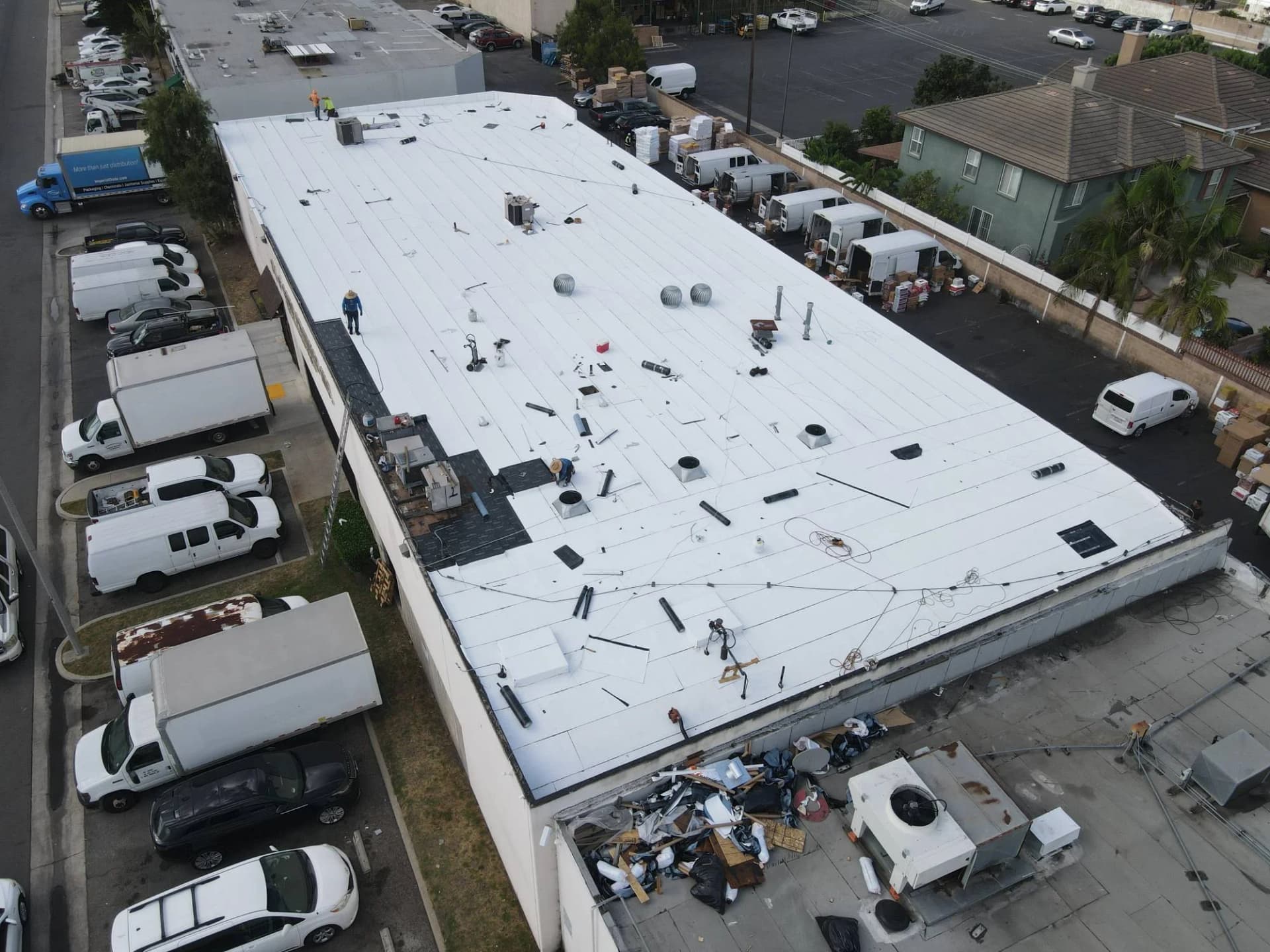Aerial view of a white low-slope commercial roof