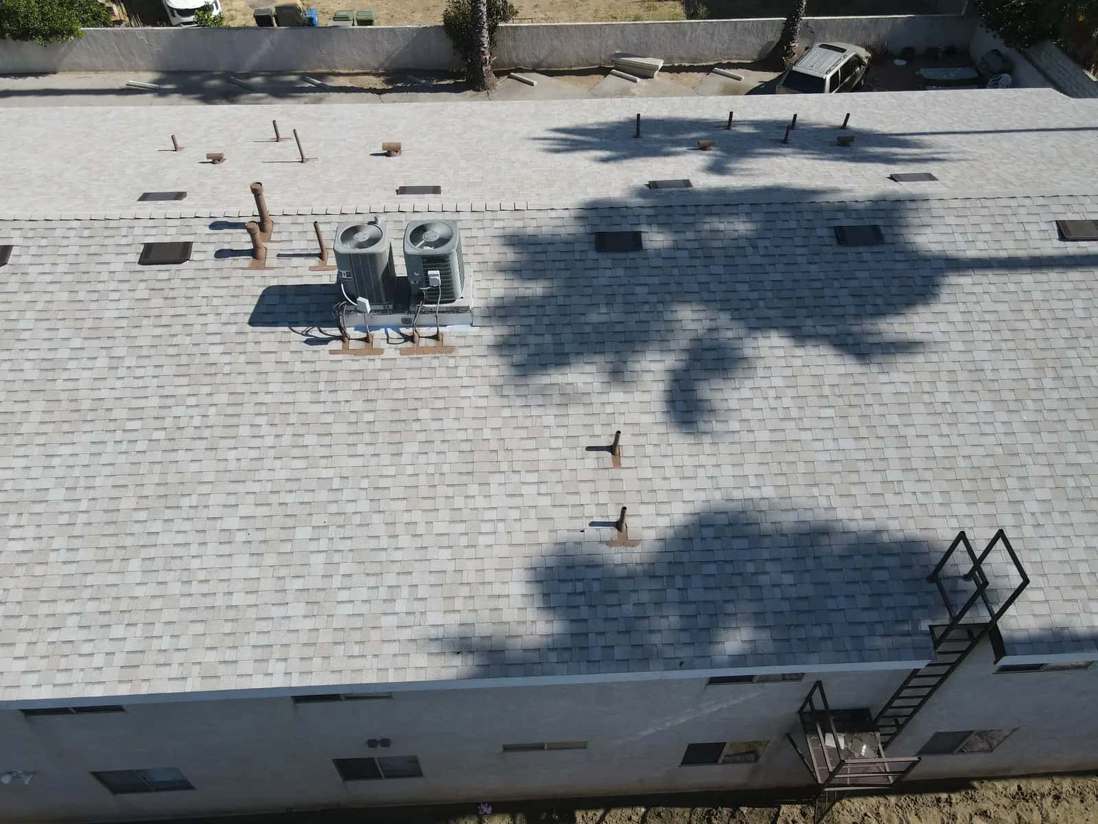 New shingle roof with box vents, pipe jacks and a pair of AC condensers