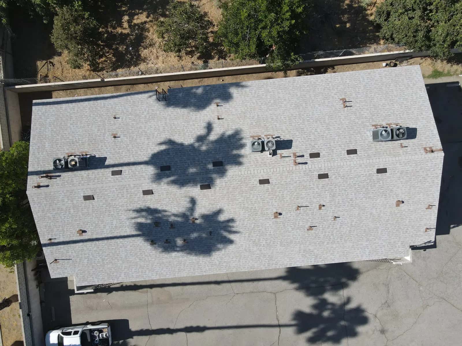Top-down view of the finished roof, showing the three pairs of rooftop AC condensers