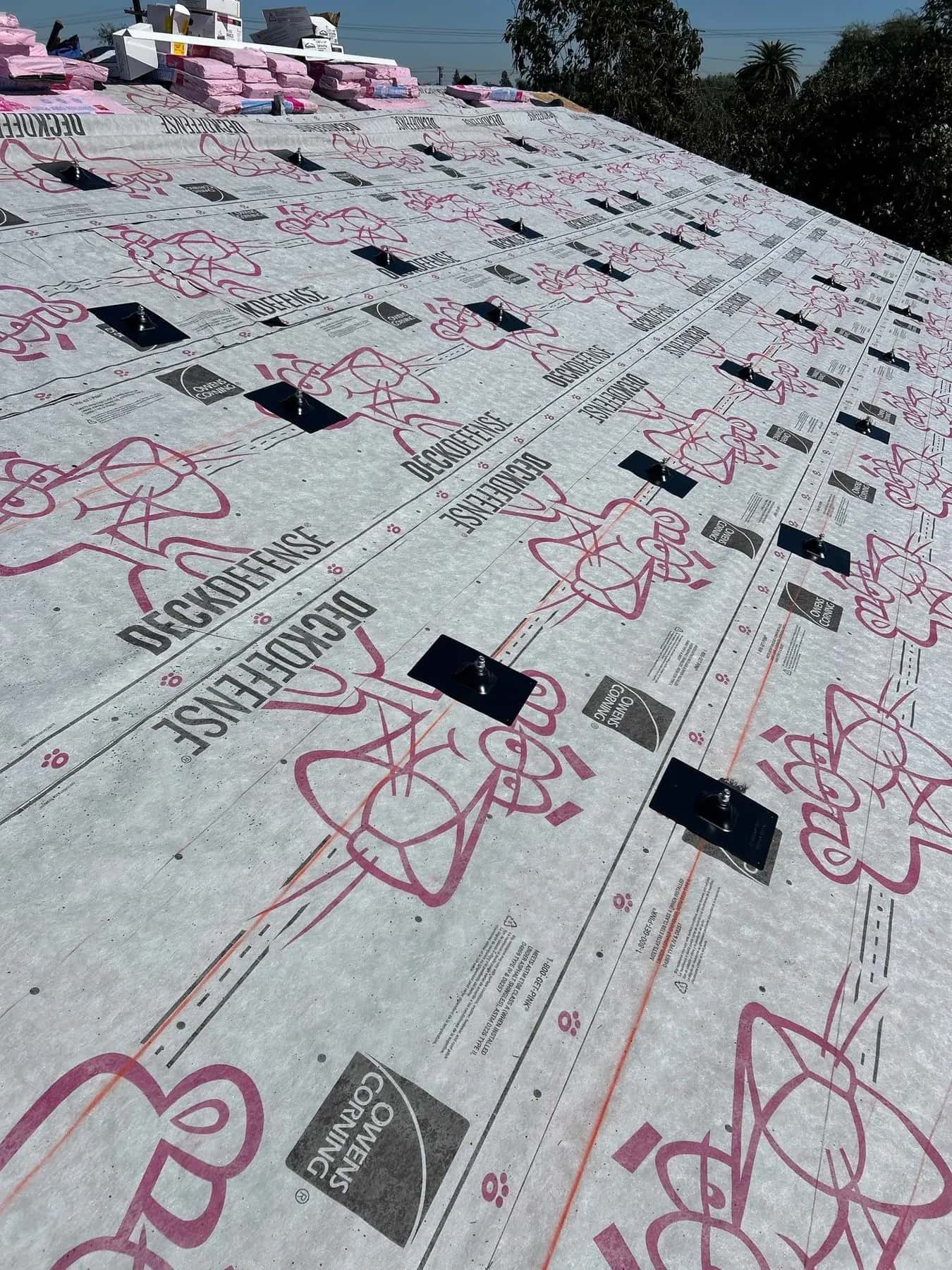 The whole roof in Owens Corning DeckDefense synthetic underlayment, with new flashed mounting points set in rows