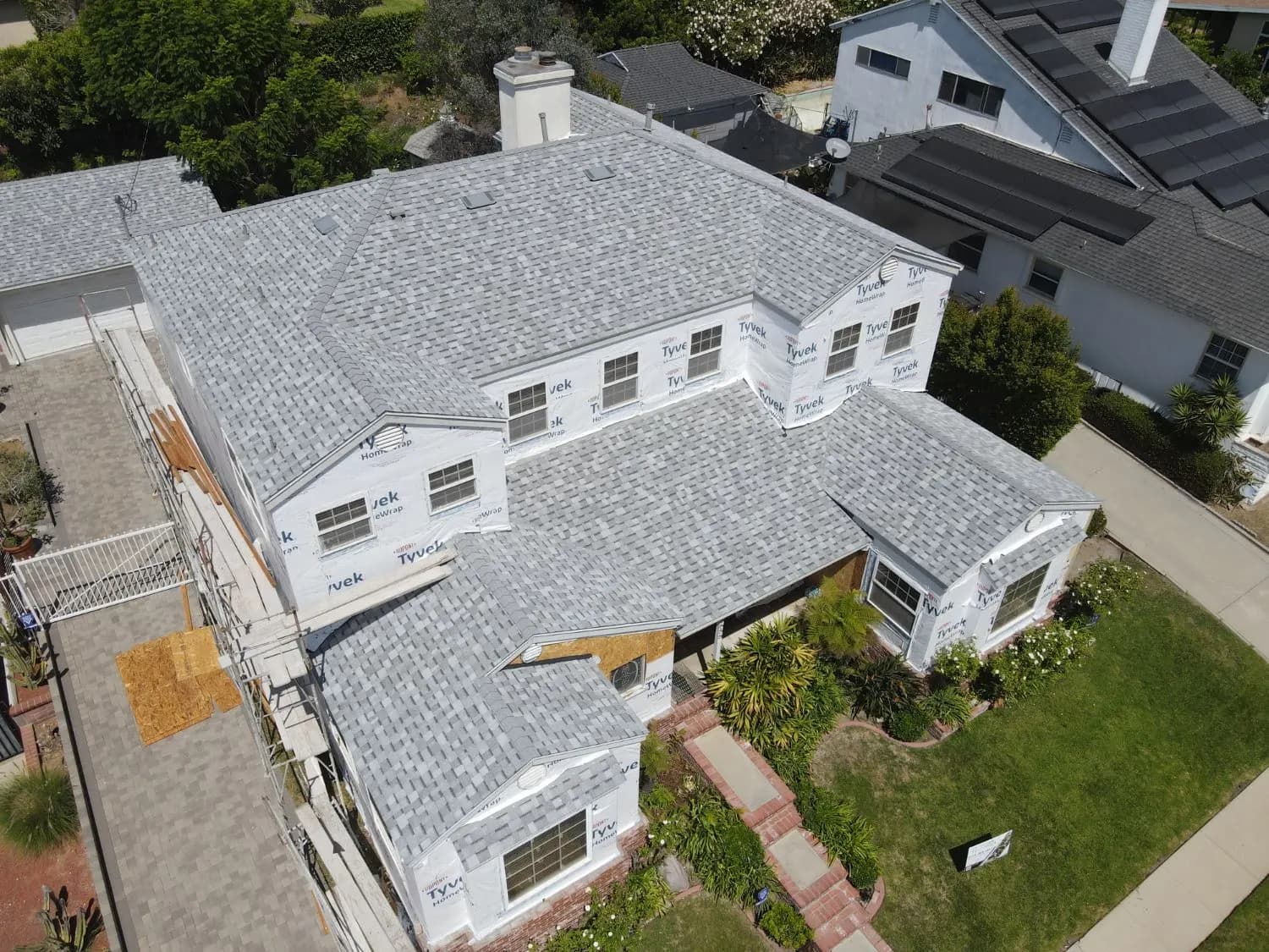 Aerial view of a home with a new shingle roof