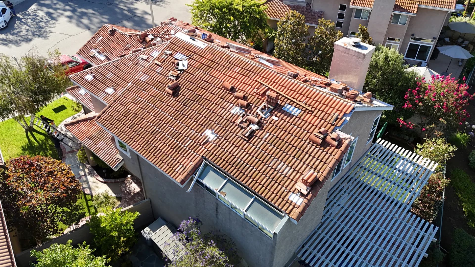 Tile roofing exposed during a lift and relay project