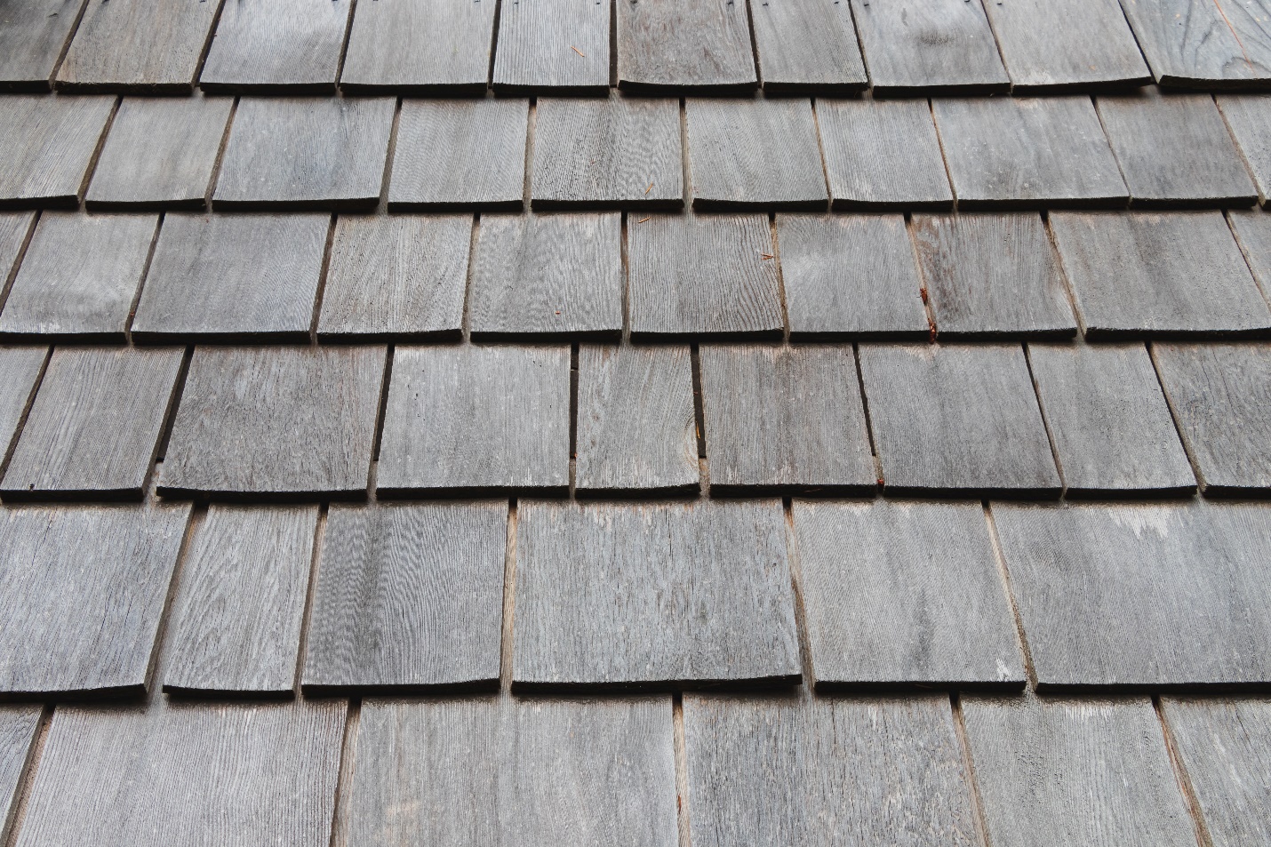 Faded shingles on rooftop captured by our Santa Fe Springs roofing contractors.